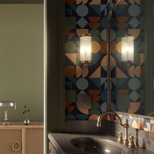 Dark moody Bauhaus geometric wallpaper in a bathroom with brass fixtures