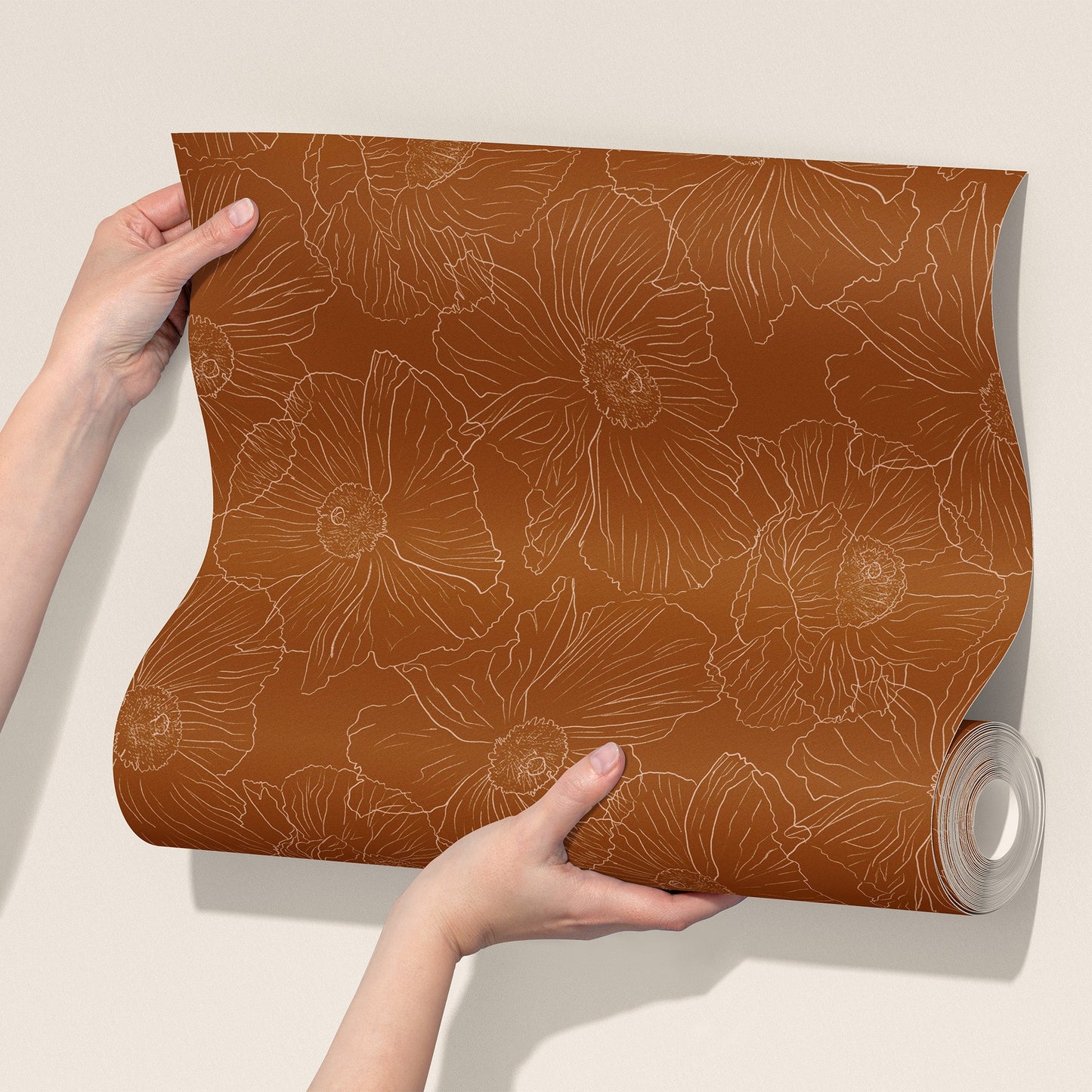  roll of cognac brown wallpaper with a light tan floral line pattern against a plain beige background.