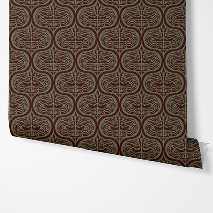 A roll of wallpaper with a repeating geometric pattern in dark burgundy and olive green, shown partially unrolled against a clean white background.