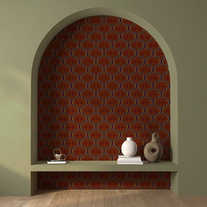 A styled interior scene showing a decorative arched alcove with a repeating terracotta and brown ornamental wallpaper pattern on the back wall, plus a built-in shelf with books and ceramic vases.