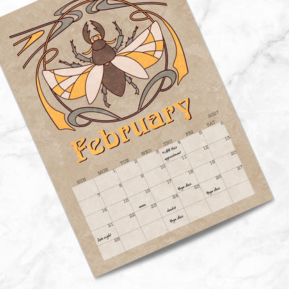 February page of the Art Nouveau Garden Dreams wall calendar with a stag beetle illustration