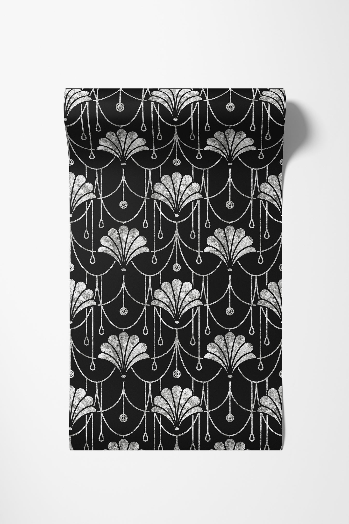 A rectangular black fabric item, likely a towel or blanket, featuring a repeating white Art Deco fan and chain pattern, shown against a plain white background.