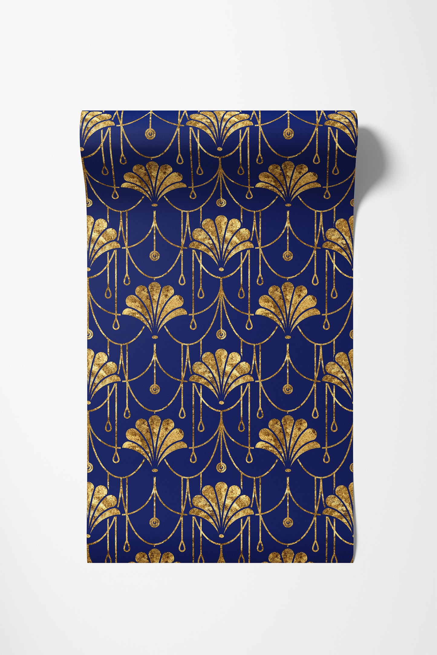 A rectangular fabric panel or napkin featuring an elegant Art Deco pattern in metallic gold on a deep navy blue background, displayed flat against a light gray studio backdrop.