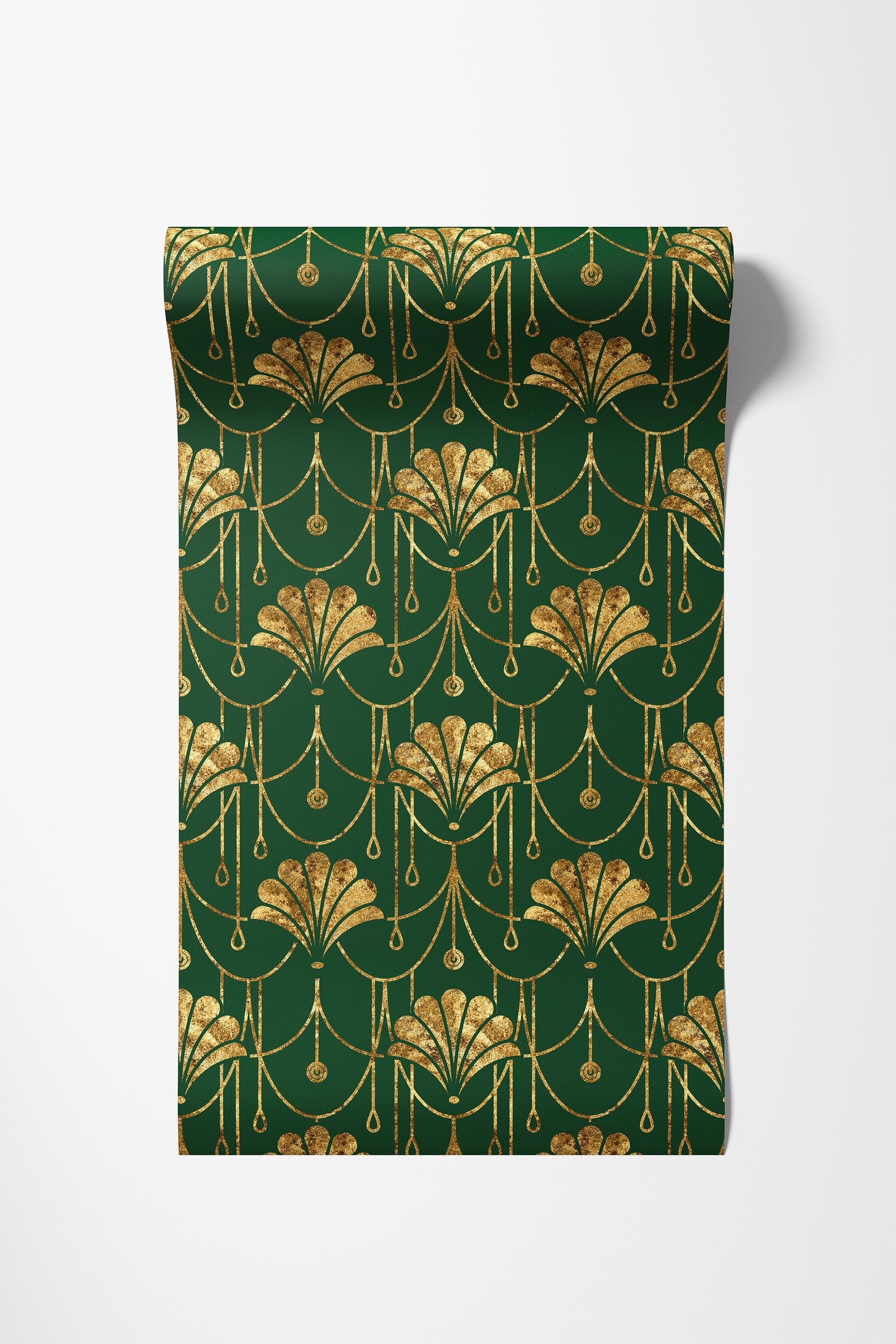 A roll of wrapping paper with a dark green background and an elegant gold Art Deco pattern, shown partially unrolled on a light gray background.