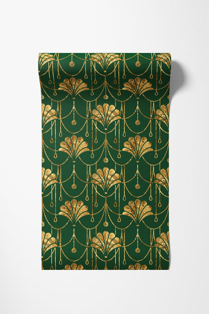 A roll of wrapping paper with a dark green background and an elegant gold Art Deco pattern, shown partially unrolled on a light gray background.
