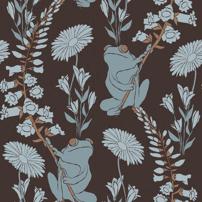 A repeating vintage-style botanical pattern featuring pale blue-green frogs clinging to flowering branches against a dark brown background.