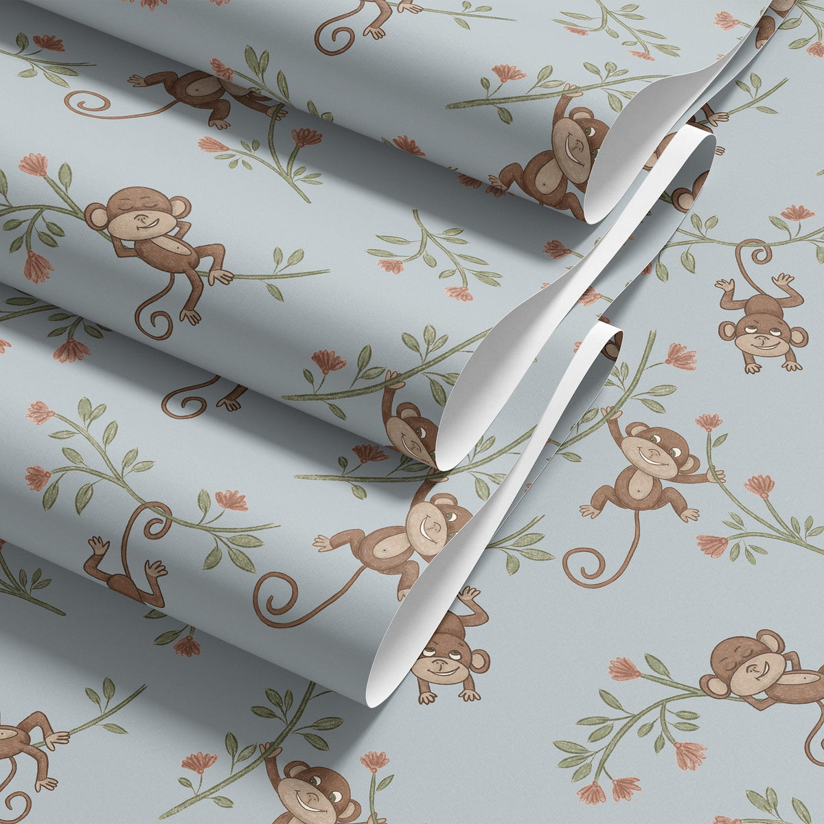 Folded roll of Monkey Babies wallpaper in blue