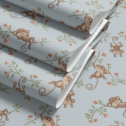 Folded roll of Monkey Babies wallpaper in blue