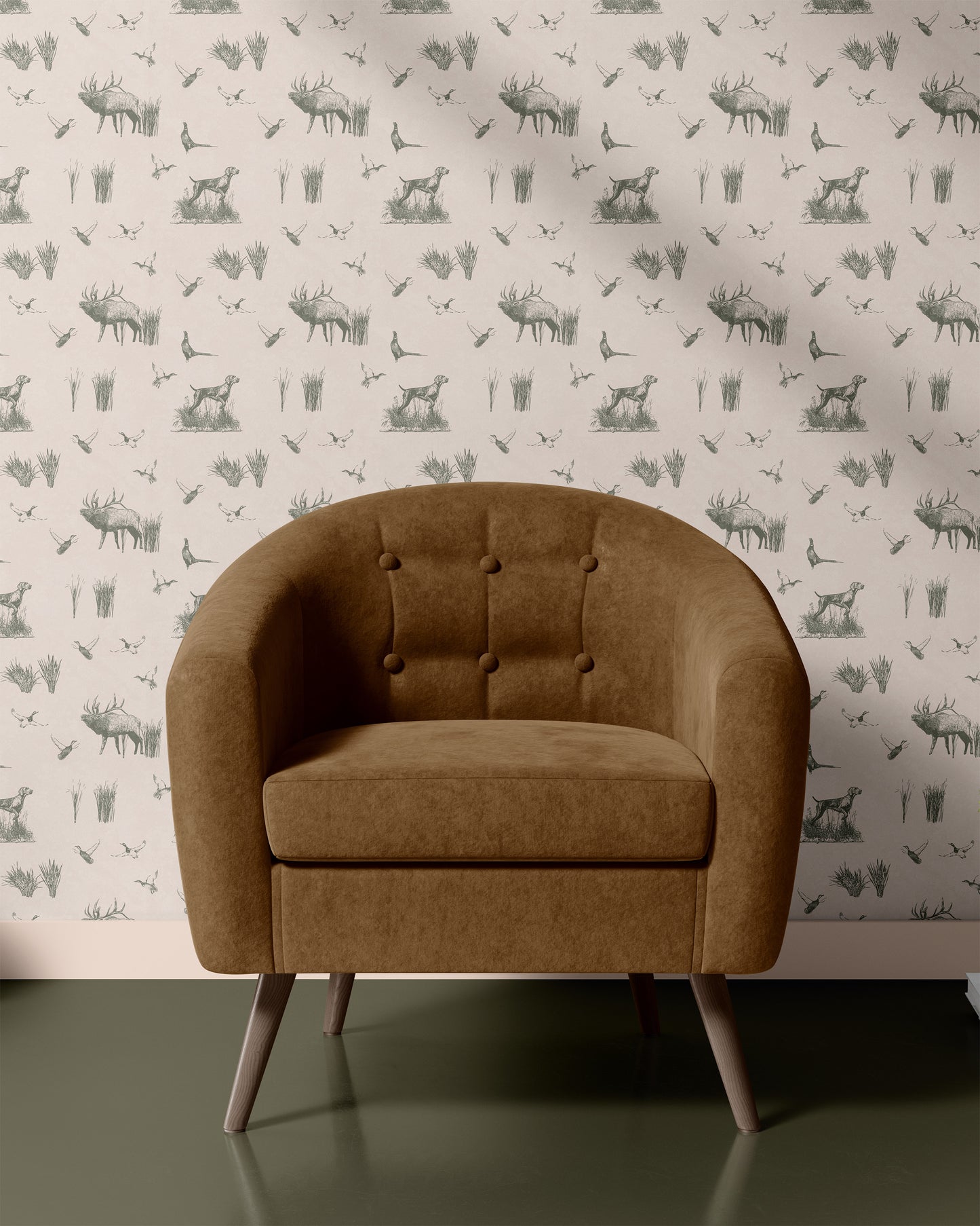 Brown armchair against a wallpaper with deer pattern