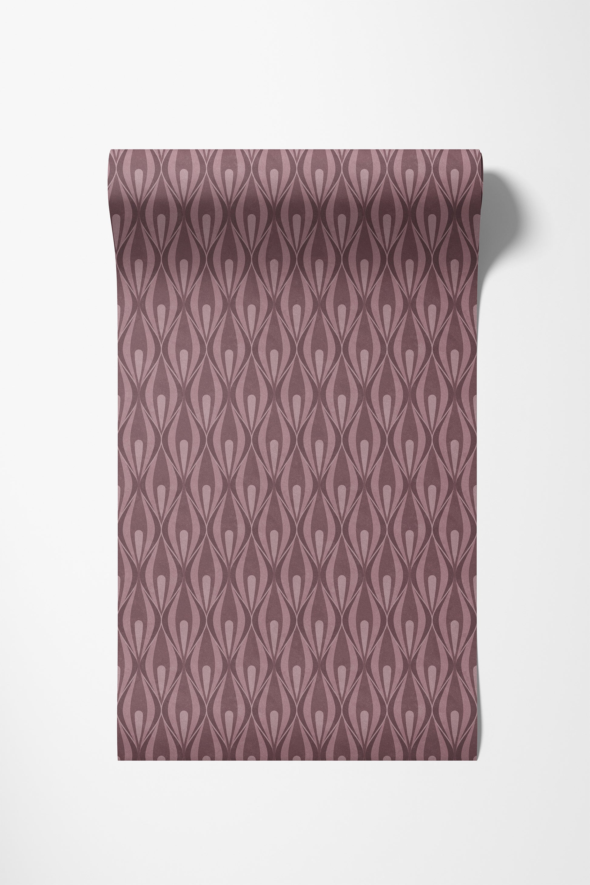 A roll of wallpaper with a dusty rose and mauve ogee pattern, shown partially unrolled against a clean white background.