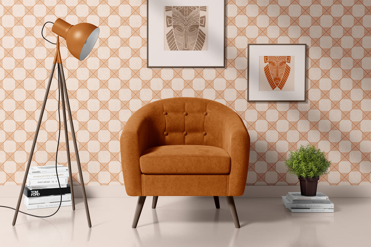 Orange lattice wallpaper behind a cognac leather armchair and floor lamp