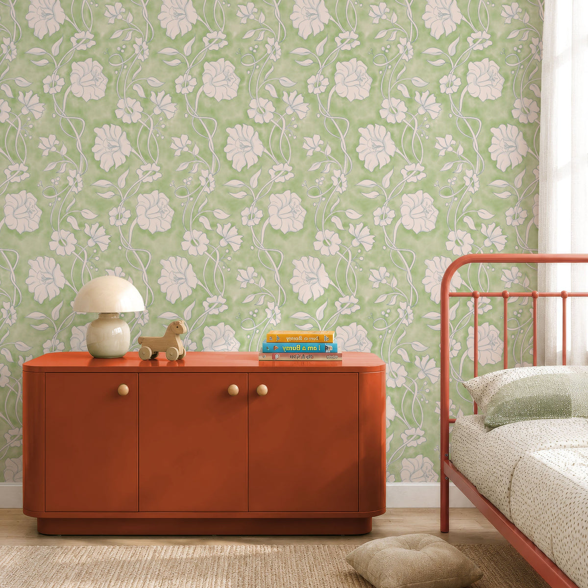 Sage green Ribbon Vine floral wallpaper behind a rust cabinet in a bedroom