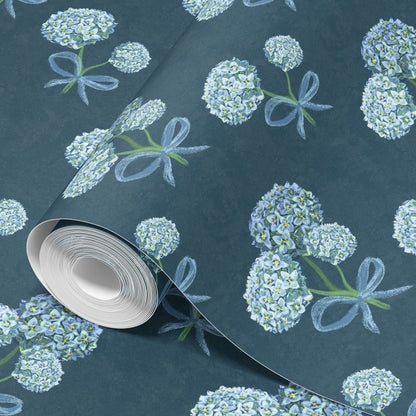 Roll of hydrangea wallpaper in blue on dark teal