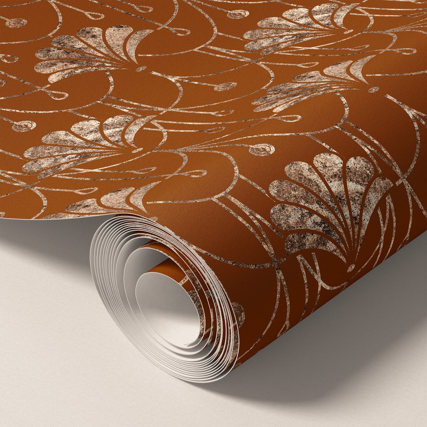 A roll of brown wrapping paper featuring a metallic rose gold foil floral pattern, shown partially unrolled on a light gray background.