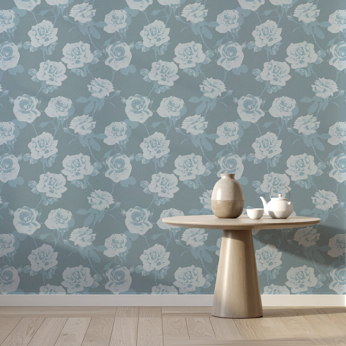 Dusty blue rose wallpaper behind a round side table