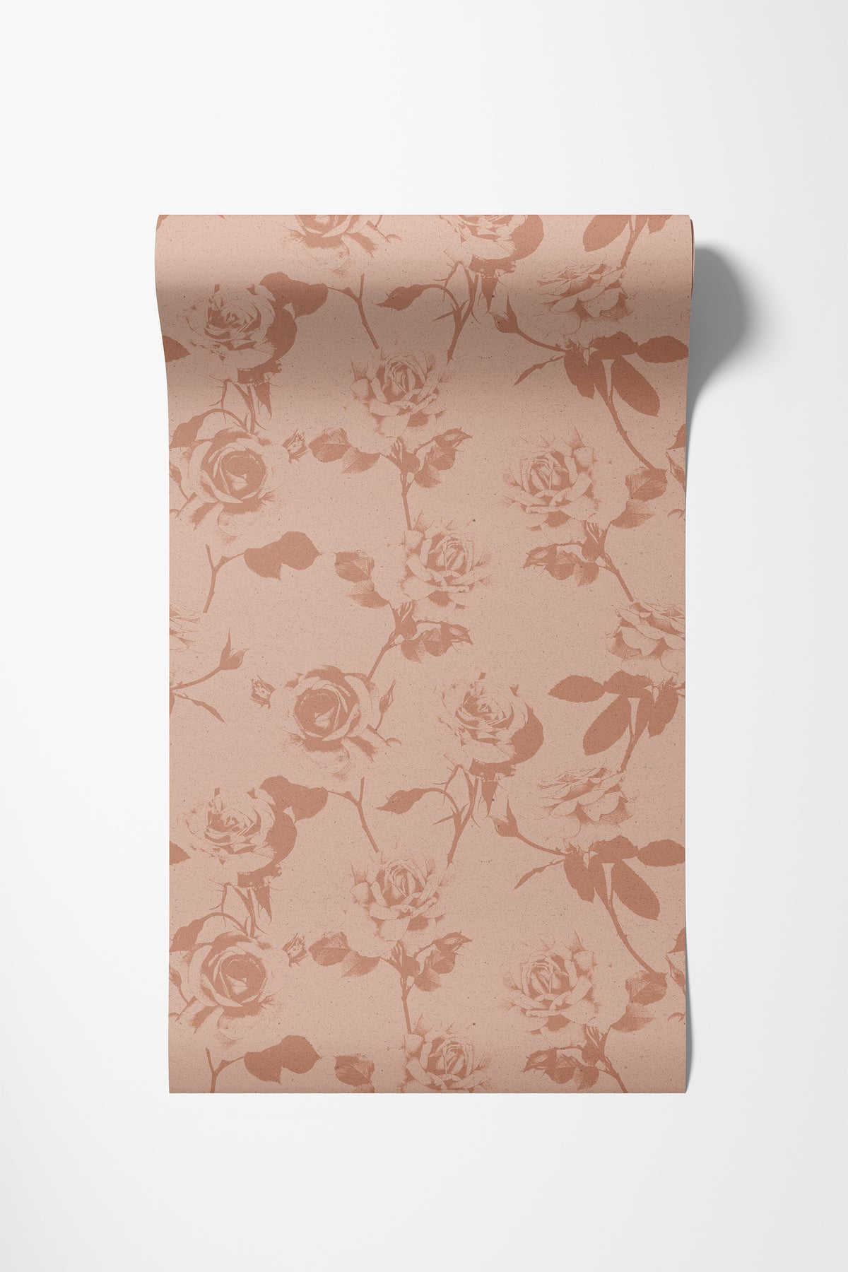 Roll of rose wallpaper in caramel on blush