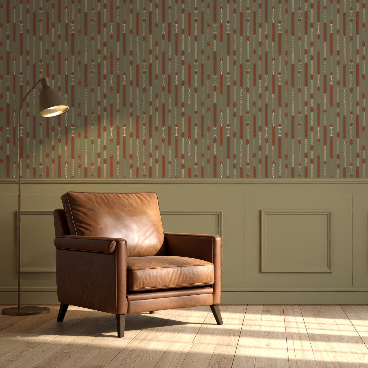 Sage green equestrian wallpaper above wall paneling with a leather armchair