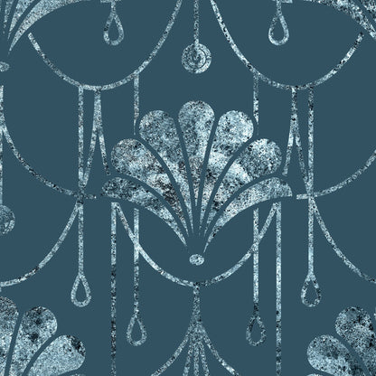 A close-up of a repeating decorative pattern featuring silver-toned ornamental leaf and hanging teardrop motifs on a dark blue background.