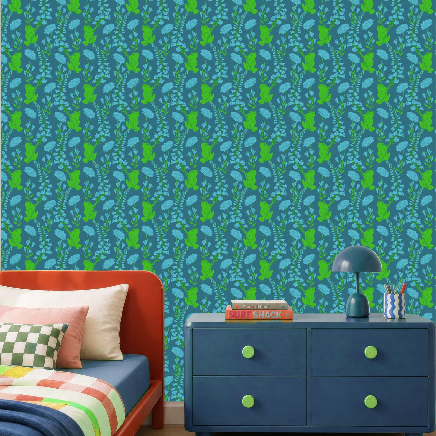 A styled bedroom interior featuring a bold wallpaper pattern with vertical green and blue motifs on a teal background. An red  bed with multicolored bedding, a blue dresser, and a striped rug are visible in the room.