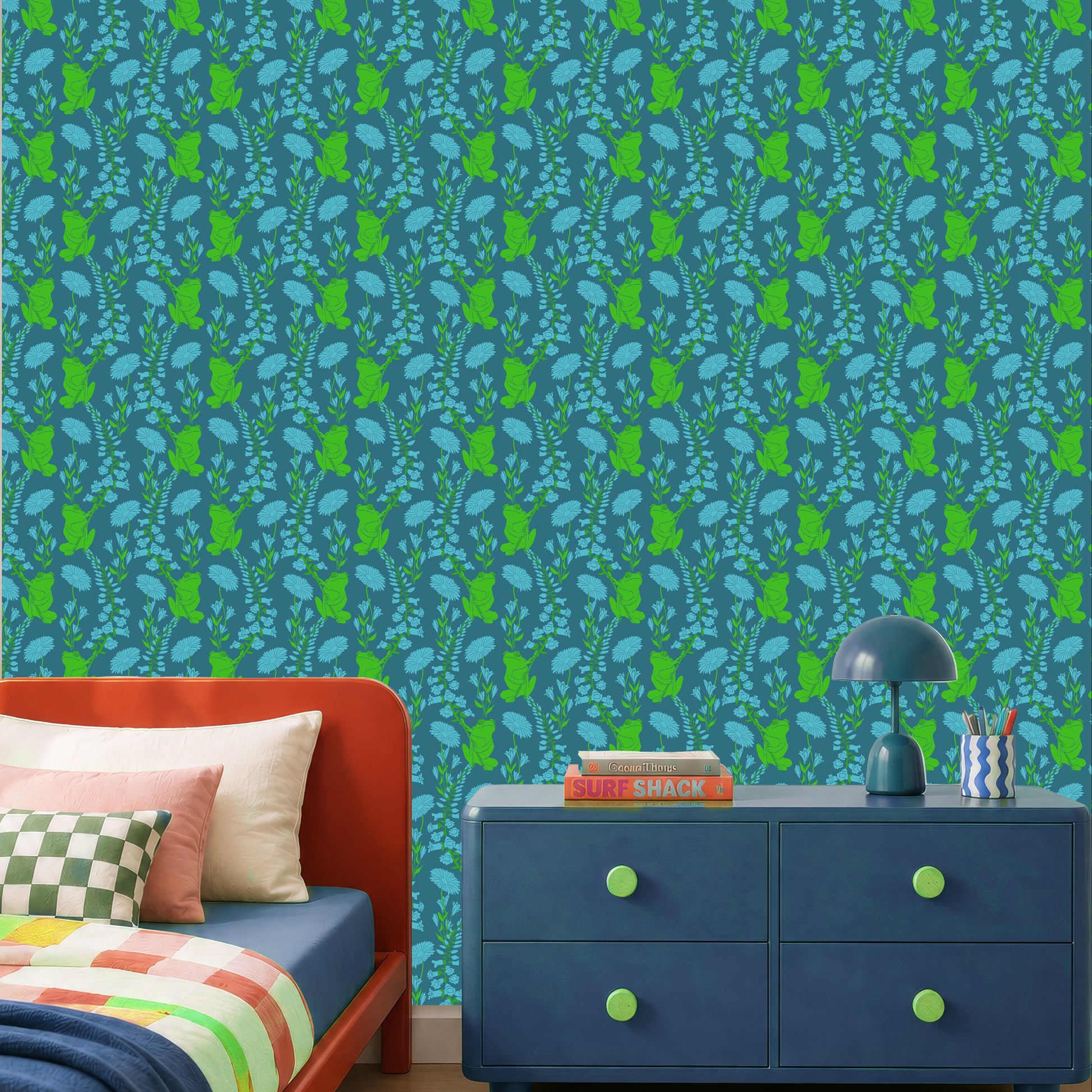A styled bedroom interior featuring a bold wallpaper pattern with vertical green and blue motifs on a teal background. An red  bed with multicolored bedding, a blue dresser, and a striped rug are visible in the room.