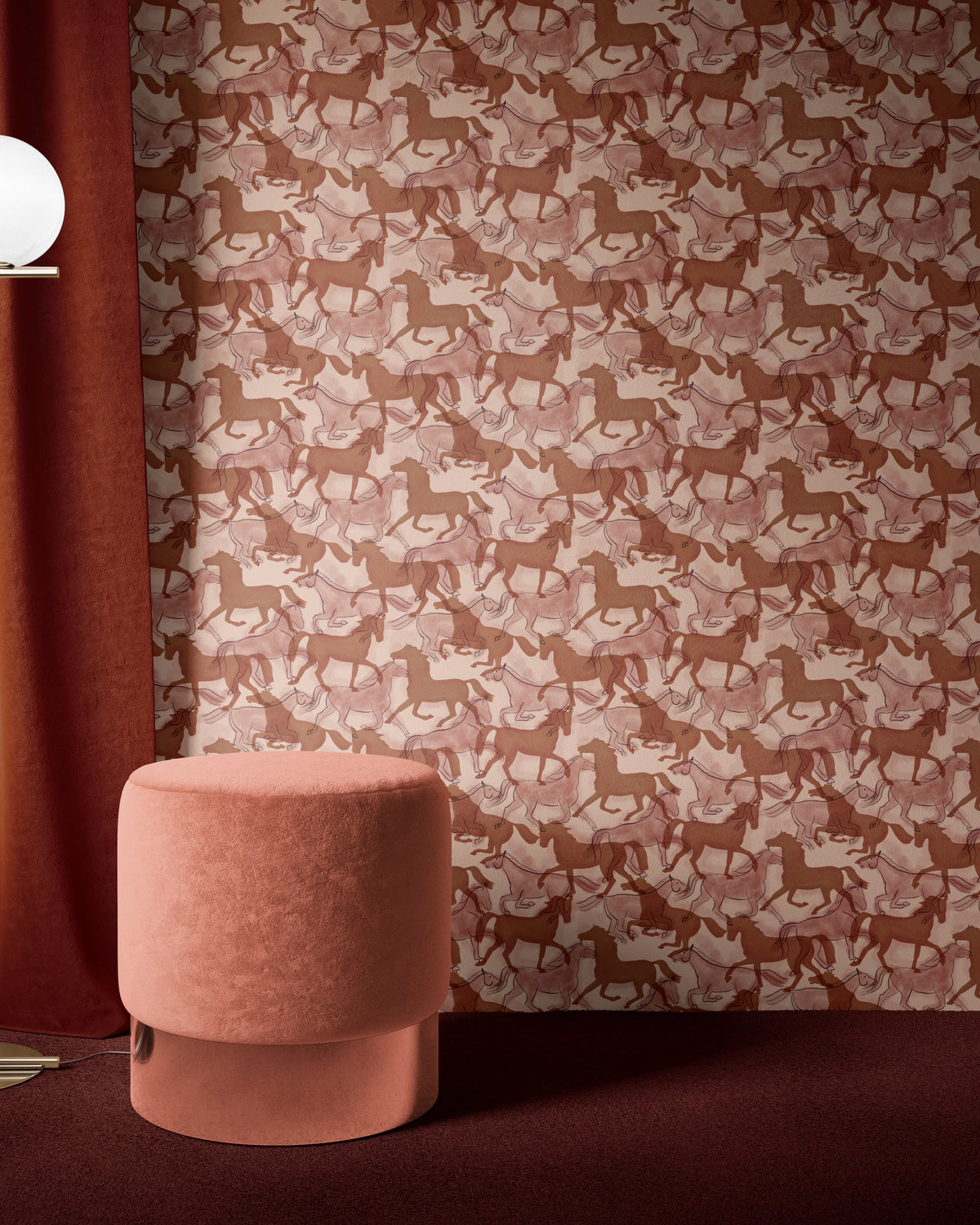 Terracotta horses wallpaper behind a pink velvet ottoman