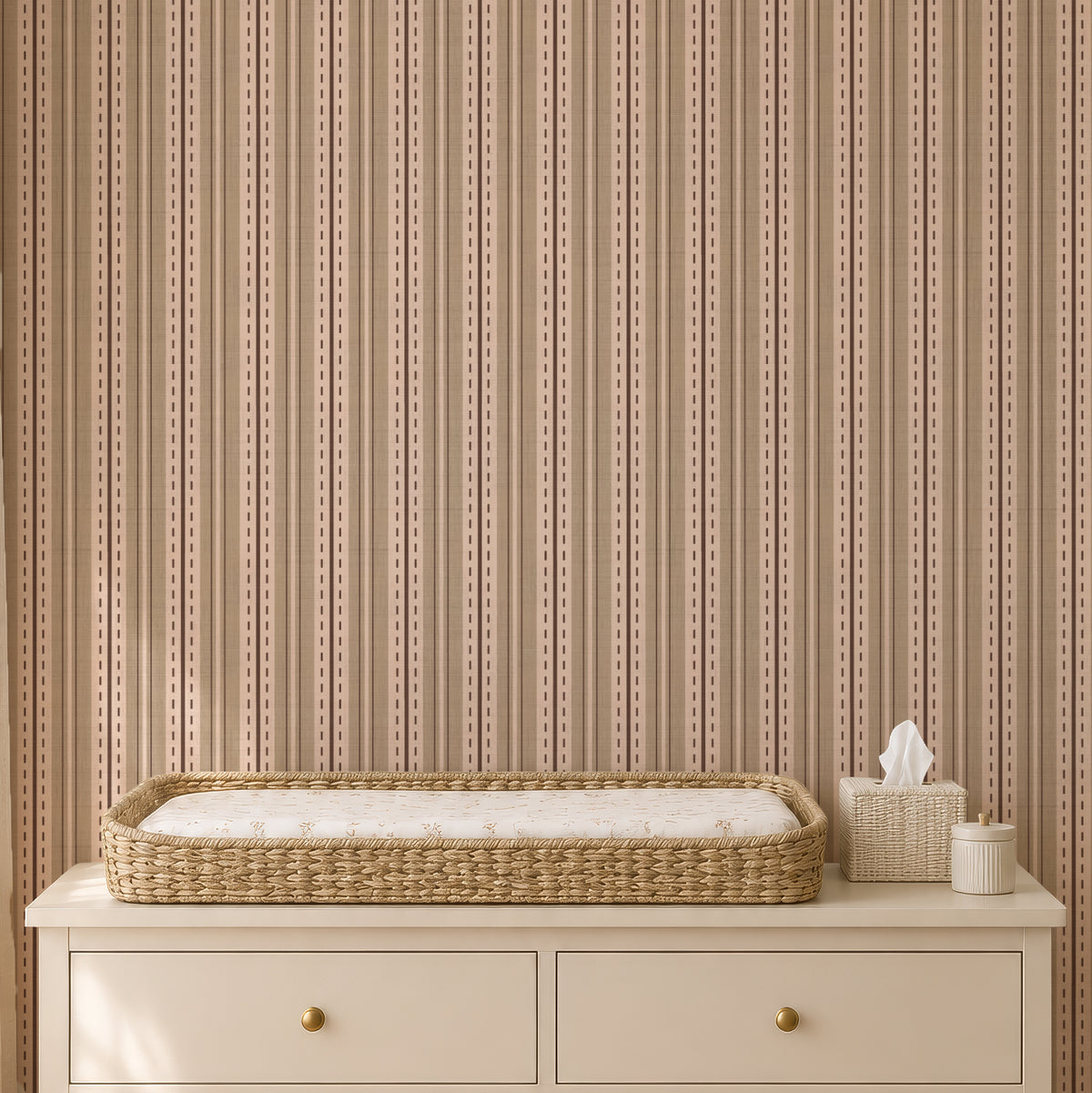 Ticking stripe wallpaper behind a nursery changing table